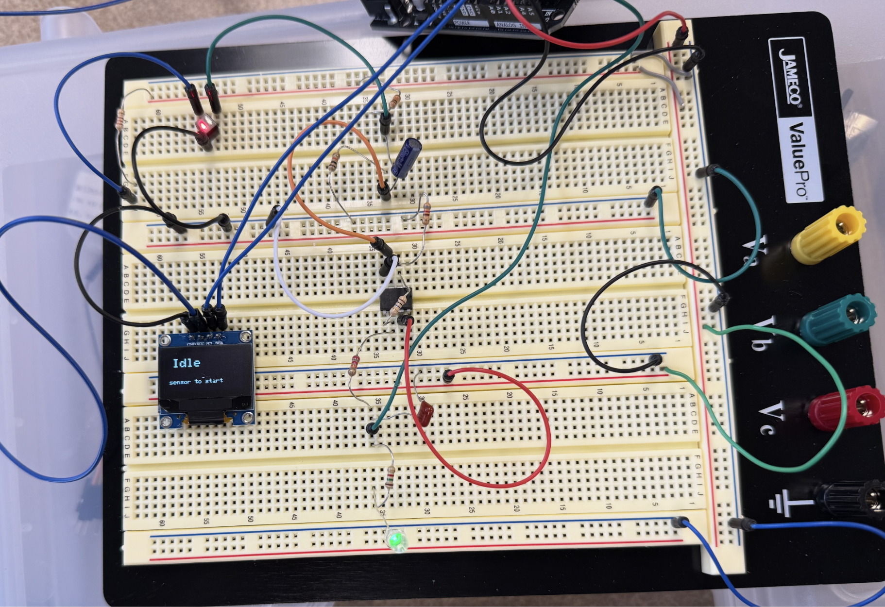 Heart rate monitor breadboard prototype with OLED display and analog circuitry